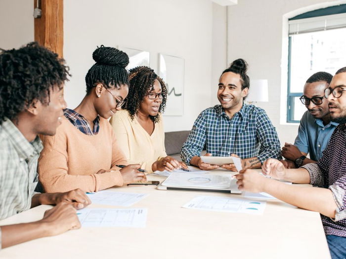 People Working at table smiling