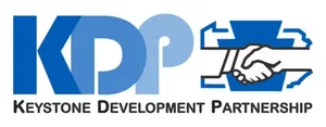 Logo for Keystone Development Partnership featuring the initials "KDP" and an emblem with two shaking hands.
